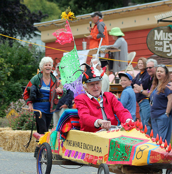 Peter Lawlor competes in Langley&rsquo;s 2016 Soup Box Derby that&rsquo;s a race to raise money for local food banks. He said heplans to enter his jalopy, &ldquo;The Whole Enchilada&rdquo; again this August, maybe with a different sauce. Running close behindhim is his daughter, Gretchen Lawlor. Photo by Kyle Jensen/South Whidbey Record