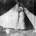 Historical image &mdash; Minnie Spencer-Plumb stands in front of a tent at Honeymoon Bay, the place she honeymooned in 1909. It&rsquo;s been named Honeymoon Bay ever since.