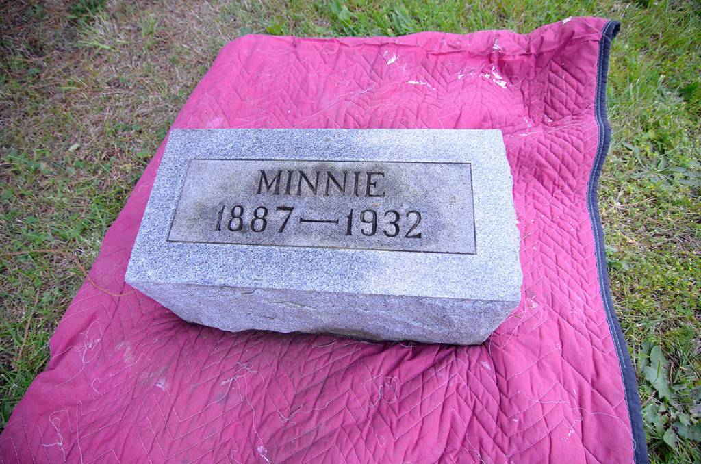 Justin Burnett/The Record &mdash; Minnie Spencer-Plumb&rsquo;s original headstone, which was moved to the Honeymoon Lake Community Club this week, only included her first name due to a family grudge related to her husband.