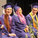 Evan Thompson / The Record &mdash; South Whidbey Academy graduate Grace Lee, third from the left, smiles as she listens to a story about her classmate. Lee was among 16 others in the 2017 graduating class of South Whidbey Academy.