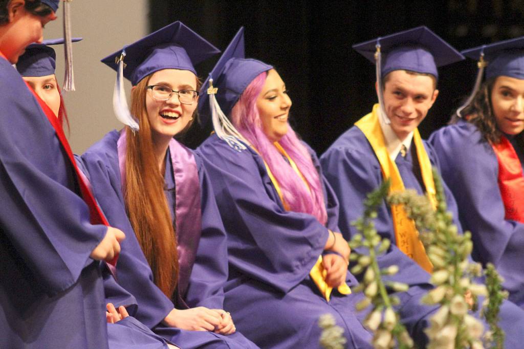 Evan Thompson / The Record &mdash; South Whidbey Academy graduate Grace Lee, third from the left, smiles as she listens to a story about her classmate. Lee was among 16 others in the 2017 graduating class of South Whidbey Academy.