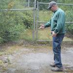 Evan Thompson / The Record &mdash; Tom Fallon, South Whidbey Parks and Recreation District&rsquo;s groundskeeper, points to where he found the bouncy house wrapped in a camouflage tarp behind a shed by Trustland Trails.