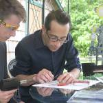 Evan Thompson / The Record &mdash; Nolan Smith, left, and Cormac McCarthy work on creating a phone charger using just an Altoids tin can on Monday afternoon.