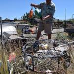 Kyle Jensen / The Record &mdash; Sunlight Beach resident Cliff Slade uses two different colored buoys as a way to identify his crab pot when the season is busy with crabbers.