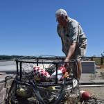 Kyle Jensen / The Record &mdash; Sunlight Beach resident Cliff Slade brings out his commercial traps from his backyard. Slade has been crabbing in Useless Bay for 60 years.