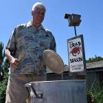 Kyle Jensen / The Record &mdash; During the summer months, Slade cooks crab in the backyard boiling station he built.