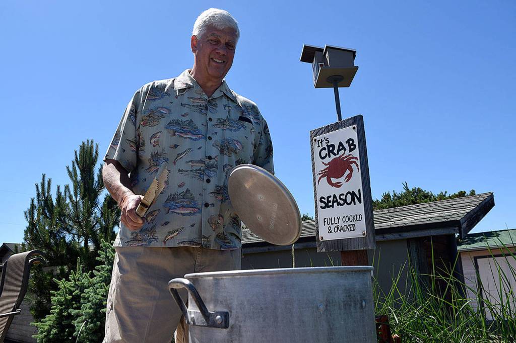 Kyle Jensen / The Record &mdash; During the summer months, Slade cooks crab in the backyard boiling station he built.