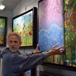 Kyle Jensen / The Record &mdash; Rochon holds his pupils&rsquo; work next to his own displayed work as a means to show them their art didn&rsquo;t look out of place.