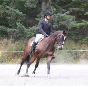 Oak Harbor&rsquo;s John Filer and Glitteratti compete in the dressage Saturday. They finished second in the Preliminary Young Rider division. (Photo by John Fisken)