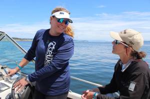 Longtime Race Week volunteers Christine Russell (left) and Liza Tewell head back to Oak Harbor Marina after observing Monday&rsquo;s first round of races.