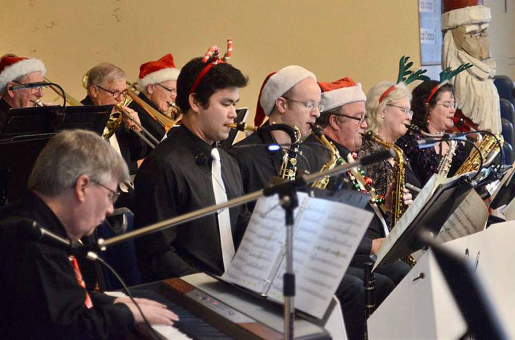 Contributed photo &mdash; Moonlight Swing Orchestra perform Christmas songs with a swing twist during a holiday performance.