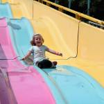 Kyle Jensen / The Record &mdash; A young girl bombs down a massive slide during opening day.