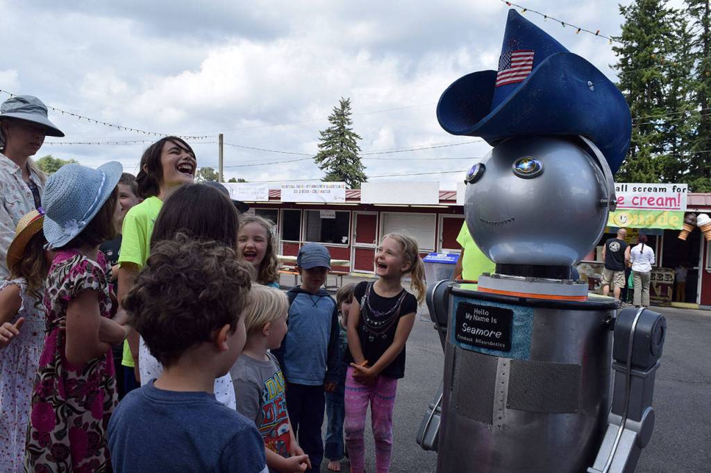 Kyle Jensen / The Record &mdash; Seamore, a talking robot who hangs around the main entrance, jokes around with curious kids.