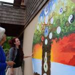 Kyle Jensen / The Record &mdash; Strong (left) and Wright (right) examine the progress of the mural. Wright estimates it&rsquo;ll be completed by the end of the summer.