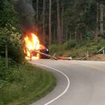 Contributed photo &mdash; A black sedan caught fire after colliding with a power pole on Bailey Road Monday morning. The driver escaped without injuries.