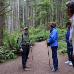 Kyle Jensen / The Record &mdash; Langley resident Richard Renninger, left, discusses possible routes in Saratoga Woods with the Meet Feet hiking group.