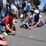 Kyle Jensen / The Record &mdash; Kids scramble for candy.