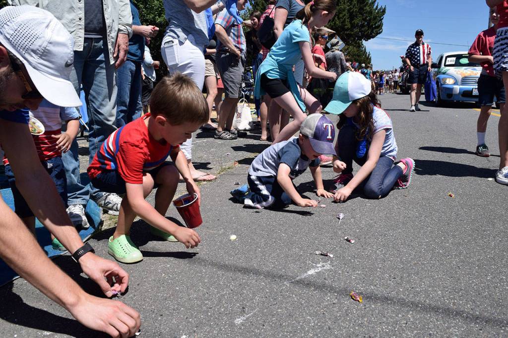Kyle Jensen / The Record &mdash; Kids scramble for candy.