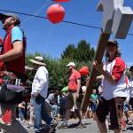 Kyle Jensen / The Record &mdash; Hearts & Hammers, the volunteer organization that does repair work on roughly 30 houses per summer, joined in on the parade festivities.