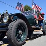 Kyle Jensen / The Record &mdash; Candy was thrown from most marchers during the Maxwelton Independence Day Parade, including this old fire engine.