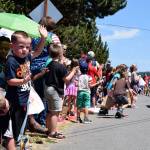 Kyle Jensen / The Record &mdash; Bystanders young and old waved to the marchers, hoping for candy.