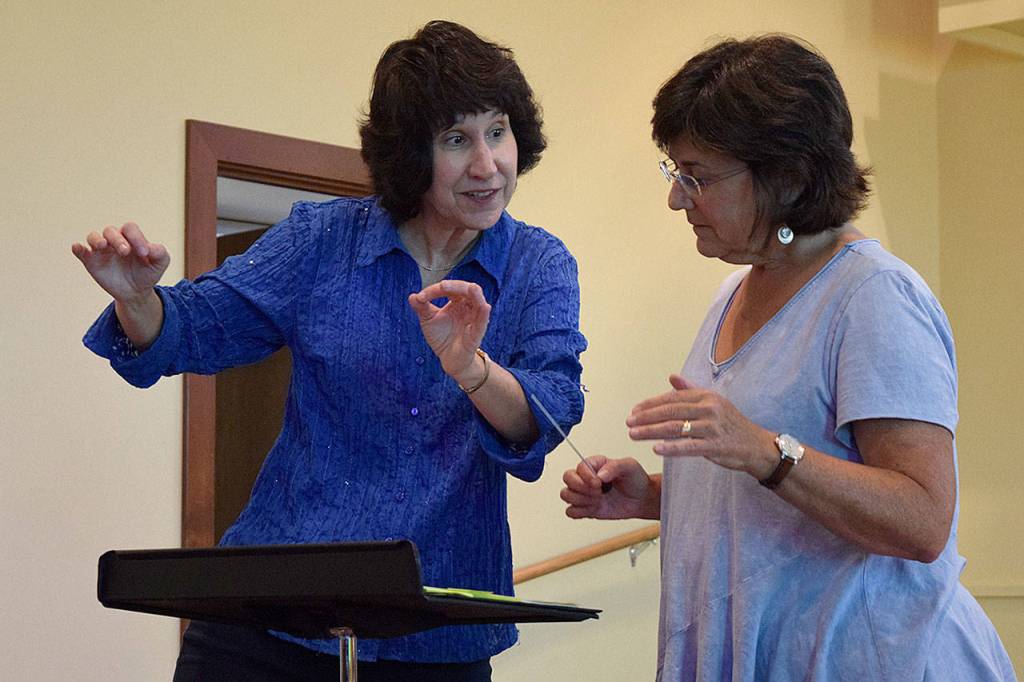 Kyle Jensen / The Record &mdash; &ldquo;Internationally acclaimed&rdquo; conductor and composer Diane Wittry gives Humphers Smith tips on how to refine her conducting technique.