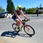 Justin Burnett / The Record &mdash; Pat Hogan of Gig Harbor whips around a corner in Langley during the Whidbey Triathlon on Saturday. He did the race with his wife, Joan Hogan.