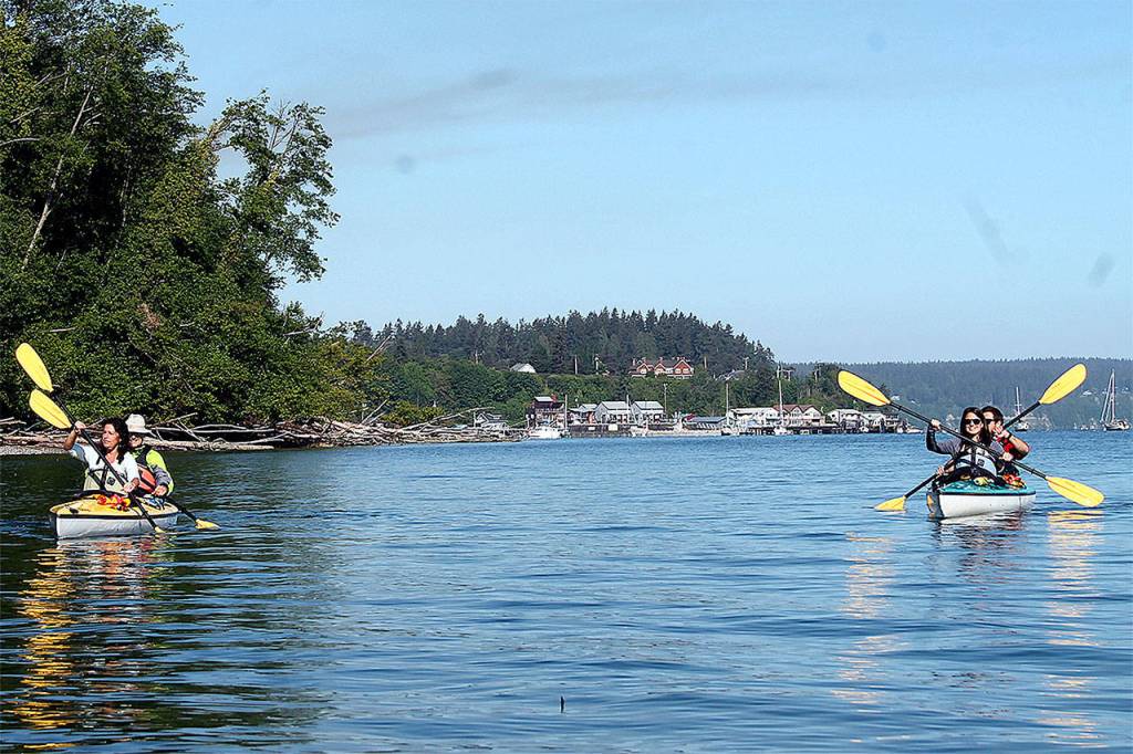 Kyle Jensen / The Record &mdash; Kayakers paddle in Saratoga Passage, near the Langley Marina, in 2016.