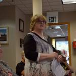 Kyle Jensen / The Record &mdash; Marilee Seligson, president of the Good Cheer board, lists her concerns with relocating the bus stop in front of the Good Cheer store on Anthes Avenue and Second Street.