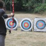 Evan Thompson / The Record &mdash; Dryah Artis, 15, aims at a target during a youth and adult archery class near the entrance of Community Park on Wednesday.