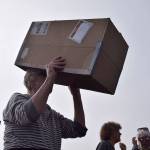 Kyle Jensen / The Record &mdash; Langley resident Marcia Wiley uses a pinhole projector made from a cardboard box to see the eclipse without directly looking at the sun.