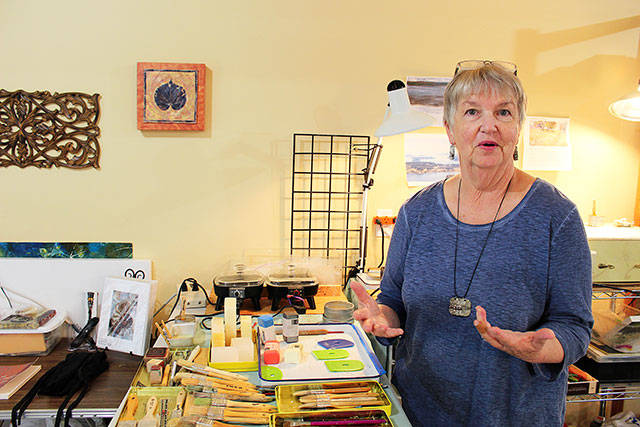 Patty Picco uses her own photographs and prints in her encaustic artwork to reproduce images of nature.