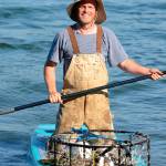 Justin Burnett / The Record &mdash; Stewart chose to drop and collect his crab pots with a paddleboard after realizing it was quicker and more environmentally friendly.