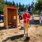 Justin Burnett/The Record &mdash; Brandon Fenton, a 17-year-old Snohomish resident, poses for the photo after installing a covered shelter he built for Good Cheer Food Bank. Behind him are his father, John Fenton, his grandfather Mike Harper, friend Chase Coffman and his grandmother Judy Harper.