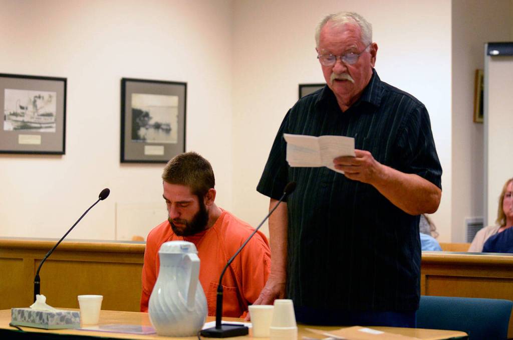 Justin Burnett/The Record &mdash; Jeffrey Lewellen sits in Island County Superior Court on Friday as his grandfather-in-law, Bruce Hancock, reads a statement about Lewellen&rsquo;s character and as a father. Lewellen was sentenced to 138 months in prison for vehicular homicide.