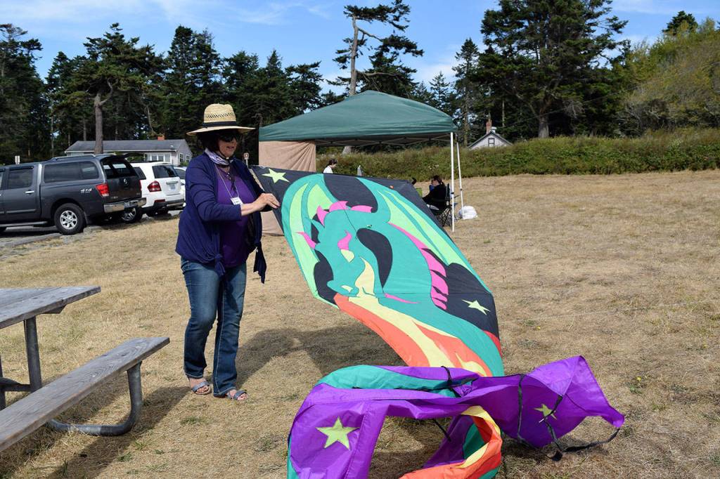 Kyle Jensen / The Record &mdash; Lake Stevens resident Mari Daniels prepares her handmade dragon kite to take flight.