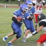 Evan Thompson / The Record &mdash; South Whidbey junior running back Caden Spear rushes for positive yardage during the Falcons&rsquo; season-opening game against Coupeville on Friday night at Jim Leierer Stadium at Waterman Field. The Falcons lost 18-0.