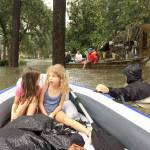 Contributed photo &mdash; The Spaulding family evacuated via an inflatable raft and motor boat after flooding from Hurricane Harvey reached their home in Houston, Texas and filled it with seven feet of water.