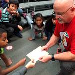 Contributed photo &mdash; Russell, the Seattle Musician of the Year in 2012, performs in front of Hillcrest Elementary School students.