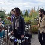 Kyle Jensen / The Record &mdash; Festivalgoers with guitars on their backs look to join a &ldquo;djam&rdquo; session at Useless Bay Coffee Company Thursday evening.