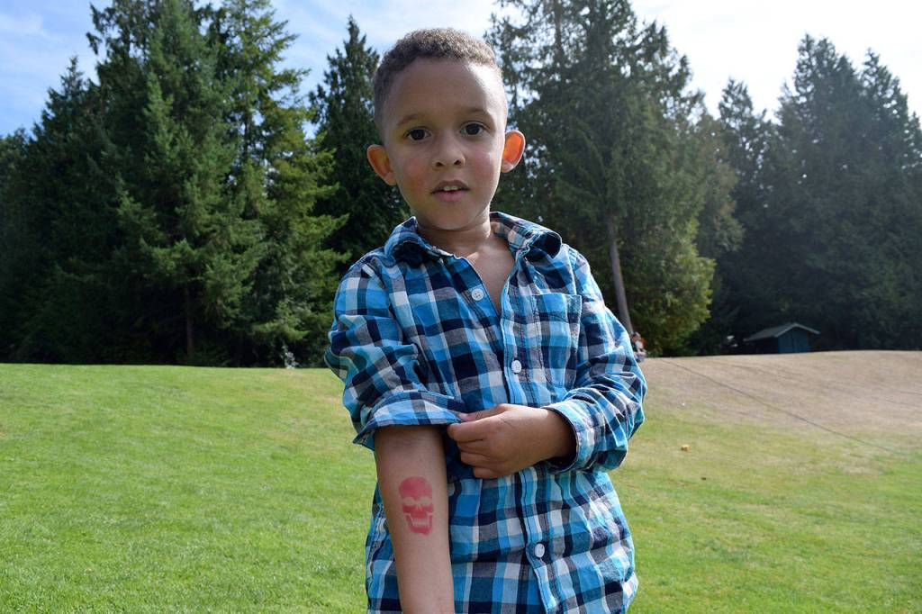 Kyle Jensen / The Record &mdash; Langley resident Jackson Alford, 3, shows off his temporary tattoo.