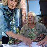 Kyle Jensen / The Record &mdash; Coyla Shepard, left, and Maralie Johnson, right, show how four people could live in a tiny house.