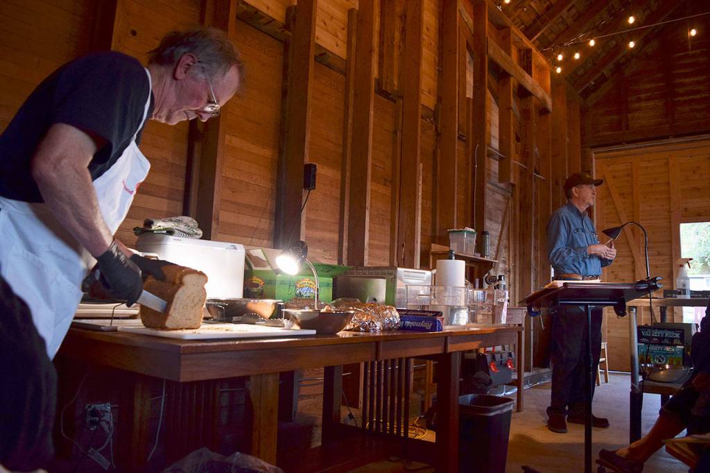 Kyle Jensen / The Record &mdash; Slow Food Whidbey Island President Mervyn Floyd, left, prepares samples during Hicken&rsquo;s first workshop. Hicken is a member of Slow Food, which centers around eating whole foods without processed ingredients.