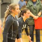 Evan Thompson / The Record &mdash; South Whidbey seniors Kolby Heggenes (left) and Sophia Nielsen prepare for a serve by Archbishop Murphy on Thursday night at Erickson Gymnasium. The Falcons narrowly lost to the top-ranked Wildcats 3-2.