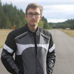 Evan Thompson / The Record &mdash; Aaron Simpson, a 31-year-old Langley resident, stands on the runway of the Langley Airport. Simpson was recently hired by Air America as an aerial imaging pilot. He&rsquo;ll travel across the country over the next year snapping photos of land that will be pieced together to form 3-D models for use by the government and a wide range of other clients.