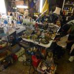 Justin Burnett/The Record                                 Clinton resident and picker John Norris sorts through items he found in a purchased storage unit.