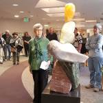 WhidbeyHealth photo &mdash; Joann Peterson examines Sue Taves&rsquo; sculpture &ldquo;Hearts&rdquo; after it is unveiled in the lobby of the WhidbeyHealth Medical Center.