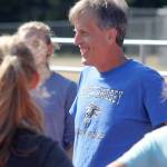 Evan Thompson / The Record &mdash; Doug Fulton goes over practice plans during the early part of the season in September. Fulton has coached South Whidbey cross country since 1997