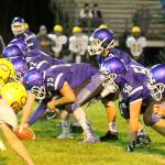Evan Thompson / The Record &mdash; South Whidbey junior quarterback Kody Newman awaits the snap from sophomore center Kobe Balora during the Falcons&rsquo; homecoming game against Concrete. The Falcons won 27-17.