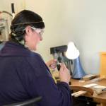 Rosalie Gale photo                                Foamy Wader owner Alexa Allamano works on one of her nautical-themes pieces of jewelry in her Langley storefront.